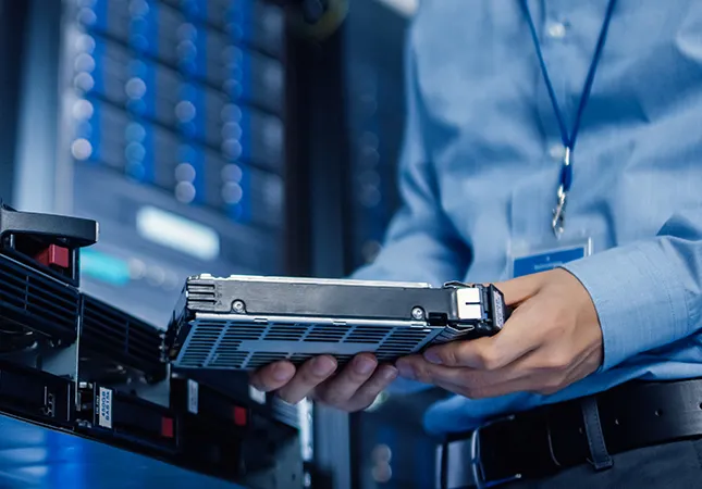 A person holding a server component.